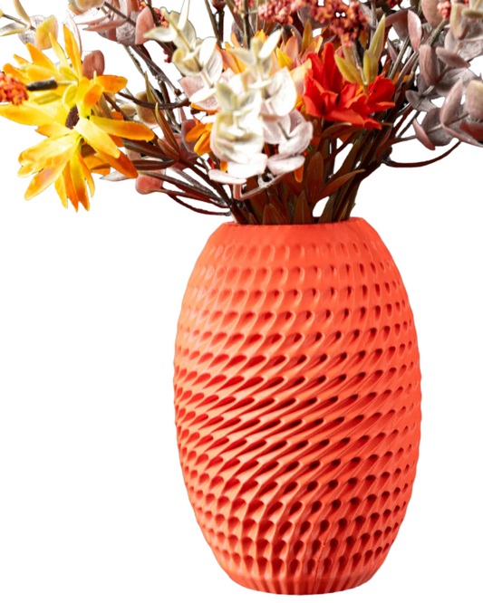 Modern 3D printed coral orange burrow flower vase with textured surface holding assorted flowers