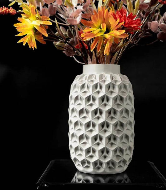 Trihex Vase white 3D printed geometric eco-friendly PLA flower vase with orange and red flowers on black background